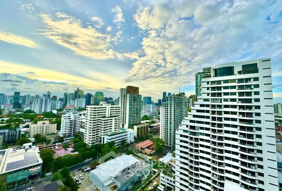 Stunning cityscape view from a high-rise building showcasing urban skyline and vibrant architecture.