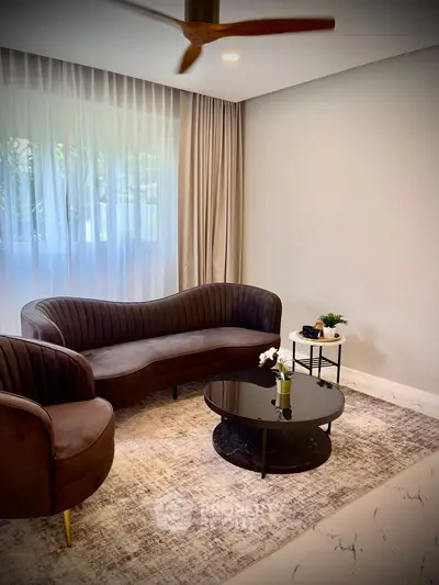 Elegant living room with modern furniture and large window