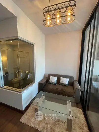 Modern living room with glass wall and stylish lighting