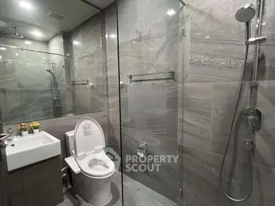 Modern bathroom with sleek glass shower and elegant fixtures