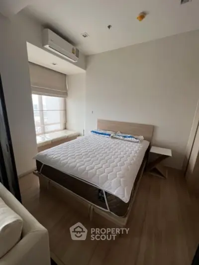 Cozy bedroom with modern design and natural light in urban apartment