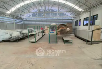 Spacious industrial warehouse with high ceilings and ample storage space.