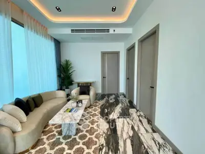 Modern living room with elegant marble flooring and stylish furniture