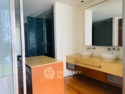 Modern bathroom with dual sinks and sleek design in luxury apartment