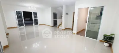 Spacious modern living room with glossy tiles and sliding doors