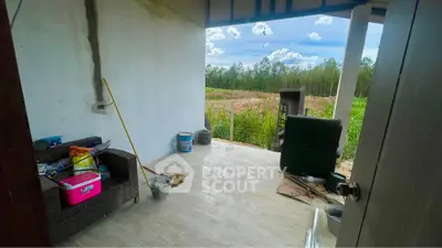 Charming patio with countryside view, perfect for relaxation and outdoor activities.