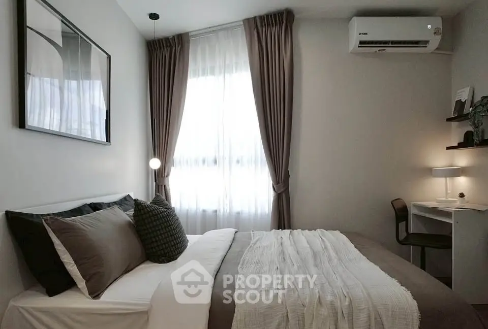 Cozy modern bedroom with stylish decor and natural light