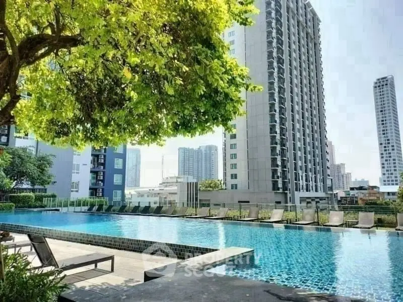 Luxurious high-rise apartment with stunning pool and city views, perfect for urban living.