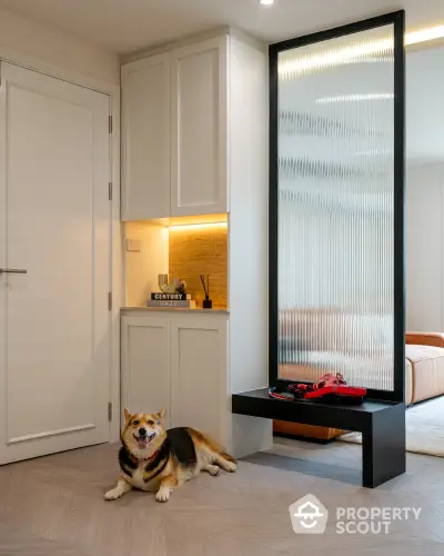 Modern living room with stylish decor and a cozy atmosphere, featuring a dog lounging on the floor.