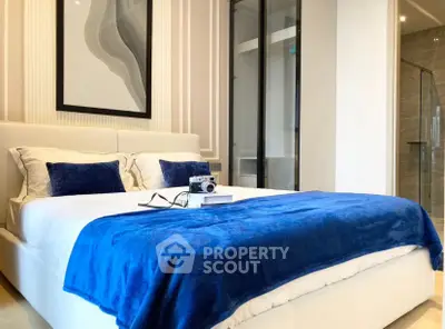 Luxurious bedroom with elegant decor and plush blue accents