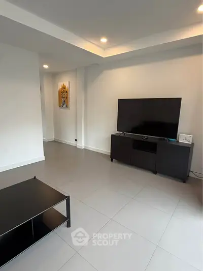 Modern living room with sleek TV stand and minimalist decor