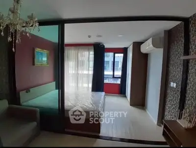 Modern bedroom with elegant chandelier and large window view