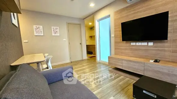 Modern living room with sleek wooden accents and wall-mounted TV
