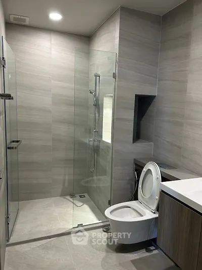Modern bathroom with sleek glass shower and contemporary fixtures