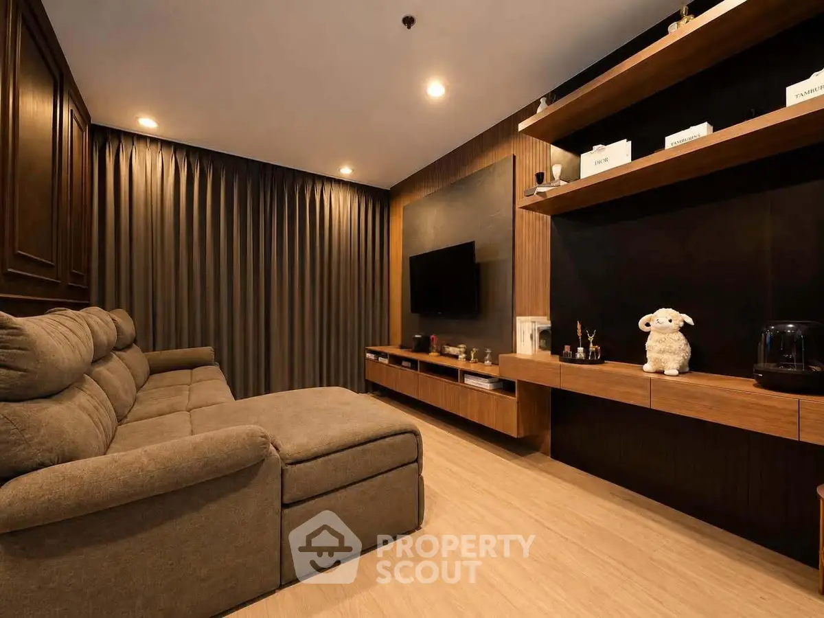 Luxurious living room with modern decor and cozy seating in elegant apartment.