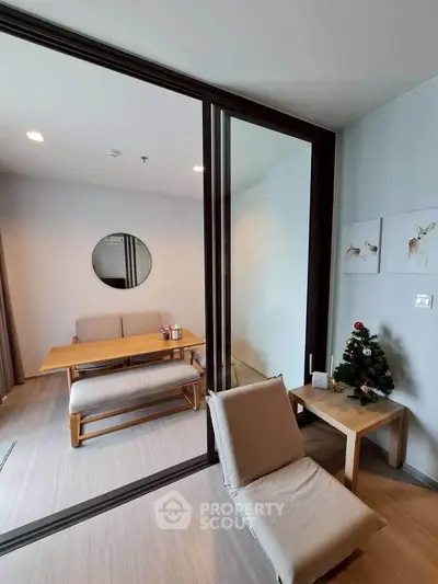 Modern living room with sliding glass doors and minimalist decor