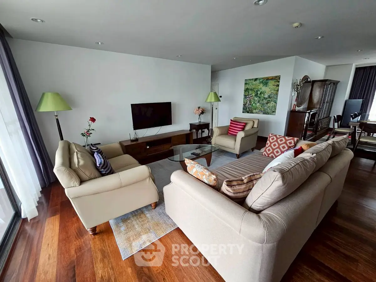 Spacious living room with elegant decor and hardwood floors in modern apartment