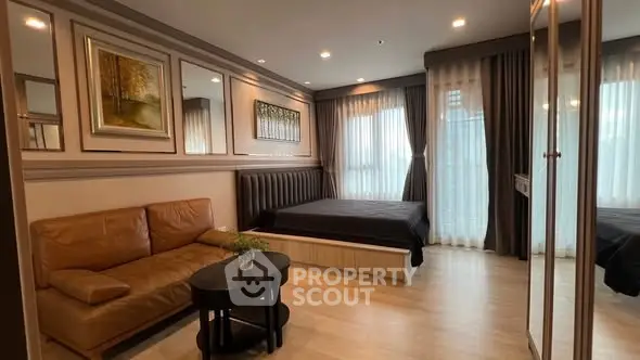 Modern bedroom with stylish decor and cozy seating area