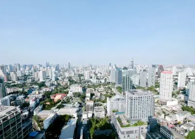 Stunning panoramic cityscape view from a high-rise building, showcasing urban skyline and vibrant city life.
