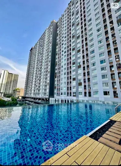 Stunning high-rise building with luxurious infinity pool and city views.