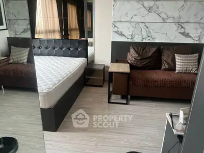 Modern bedroom with stylish decor and comfortable furnishings in a contemporary apartment.