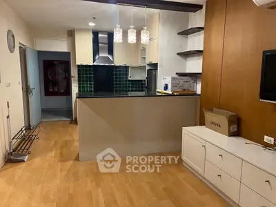 Modern kitchen with open layout and stylish lighting in cozy apartment