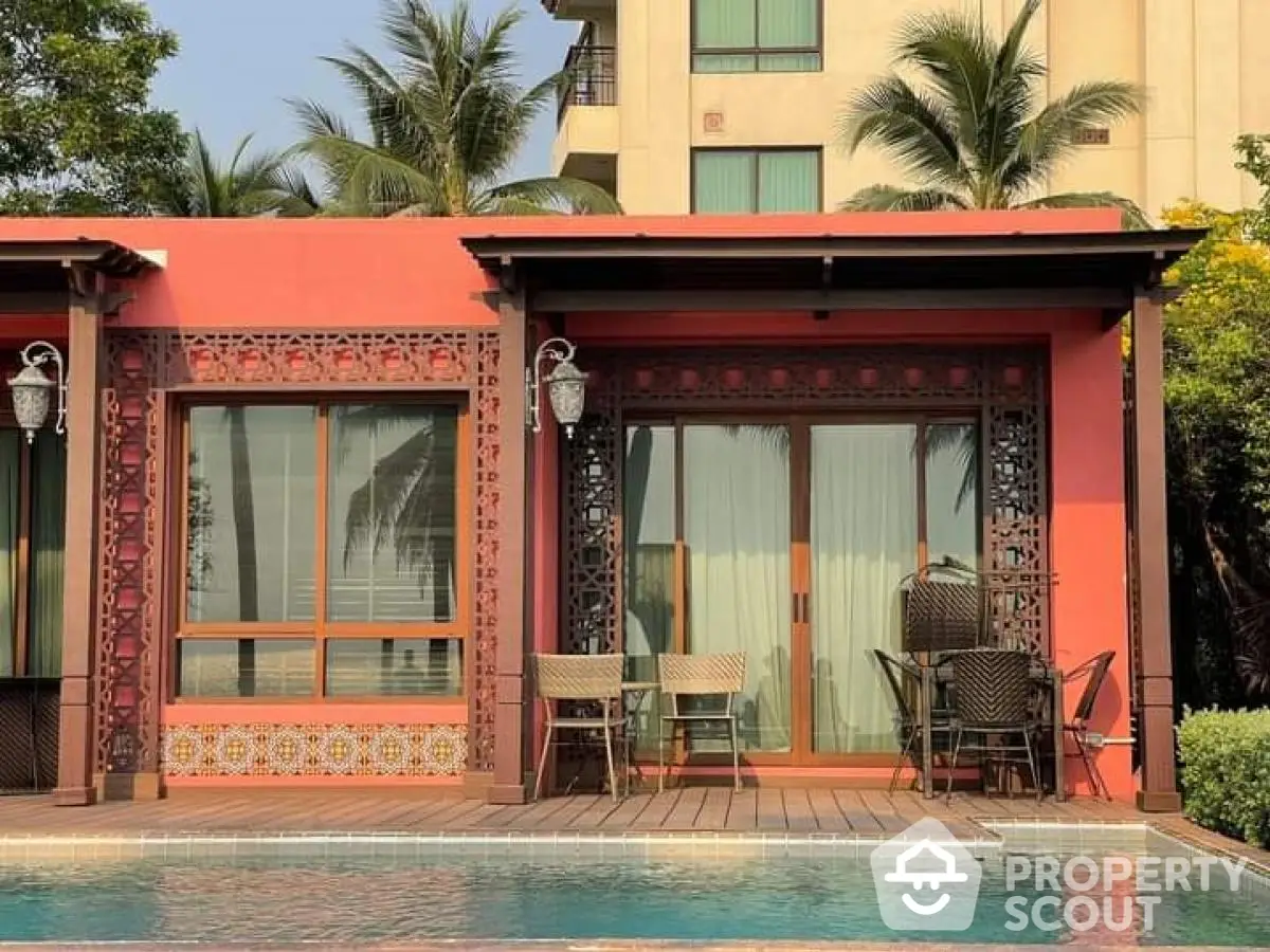 Charming poolside villa with elegant design and lush surroundings, perfect for luxury living.