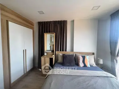 Modern bedroom with stylish decor and ample natural light