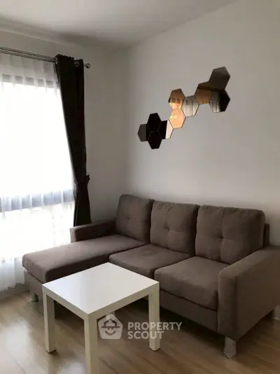 Cozy living room with modern sofa and stylish wall decor