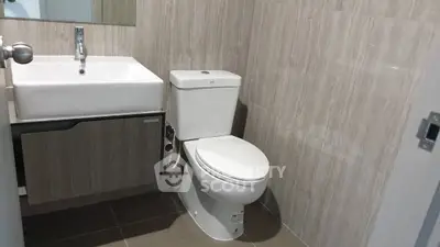 Modern bathroom with sleek fixtures and neutral tile design