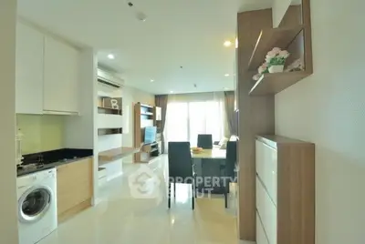 Modern living room with open layout and stylish furniture in a bright apartment.