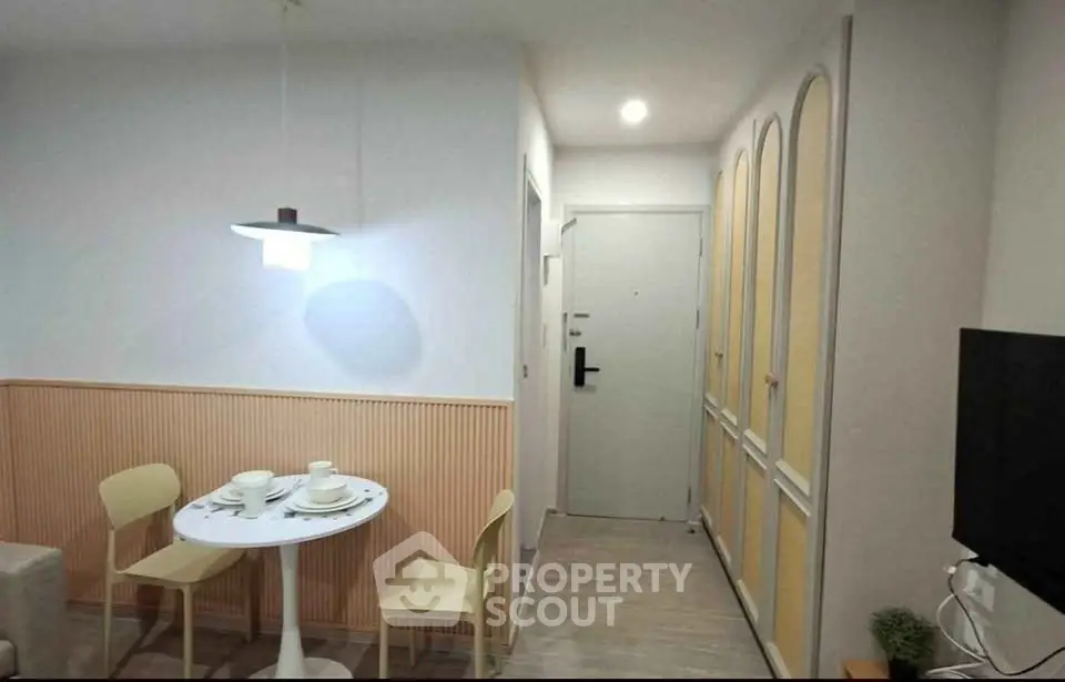 Charming dining area with modern decor and cozy ambiance in a stylish apartment.