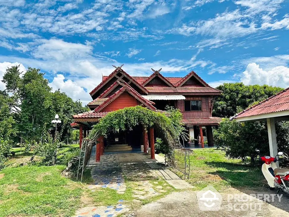 Charming traditional wooden house with lush garden and blue sky backdrop