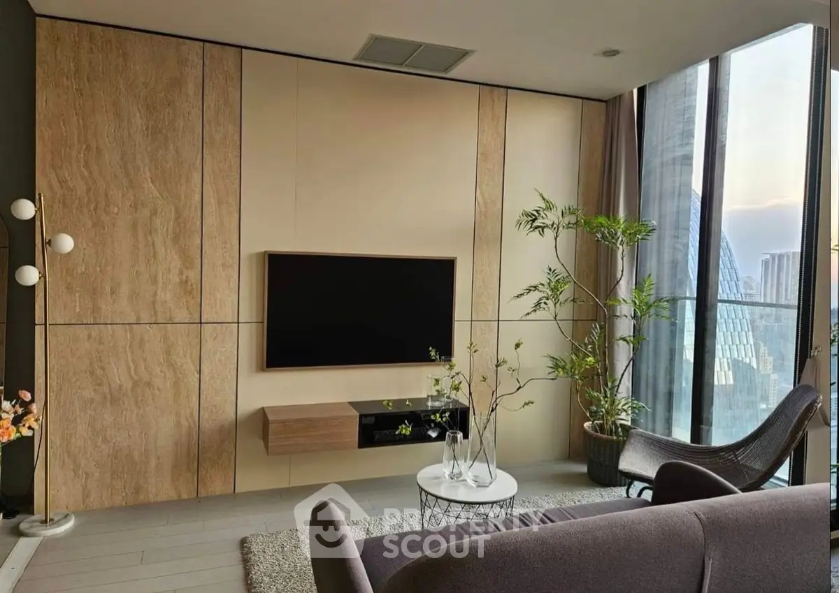 Modern living room with sleek TV setup and panoramic city view