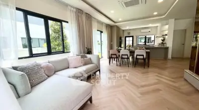 Spacious modern living room with elegant decor and open kitchen layout