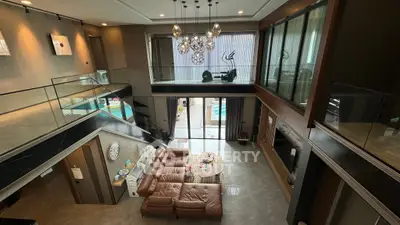 Luxurious modern living room with high ceiling and elegant decor