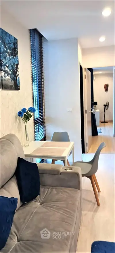 Modern living room with cozy seating and stylish decor in a contemporary apartment.