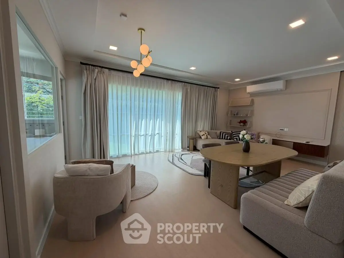 Spacious modern living room with elegant furniture and large windows