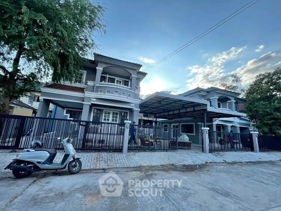 Charming suburban homes with modern architecture and spacious driveways in a serene neighborhood.