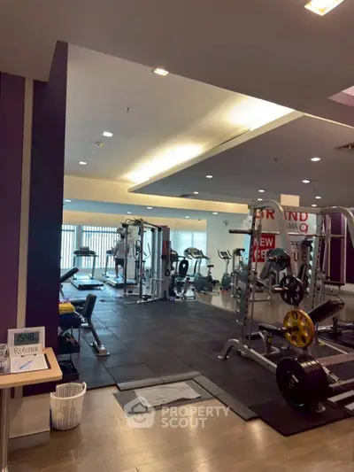 Modern gym with state-of-the-art equipment and spacious layout for fitness enthusiasts.