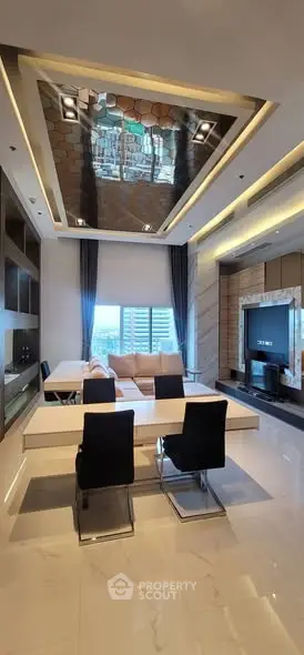 Luxurious modern living room with elegant dining area and stylish ceiling design.