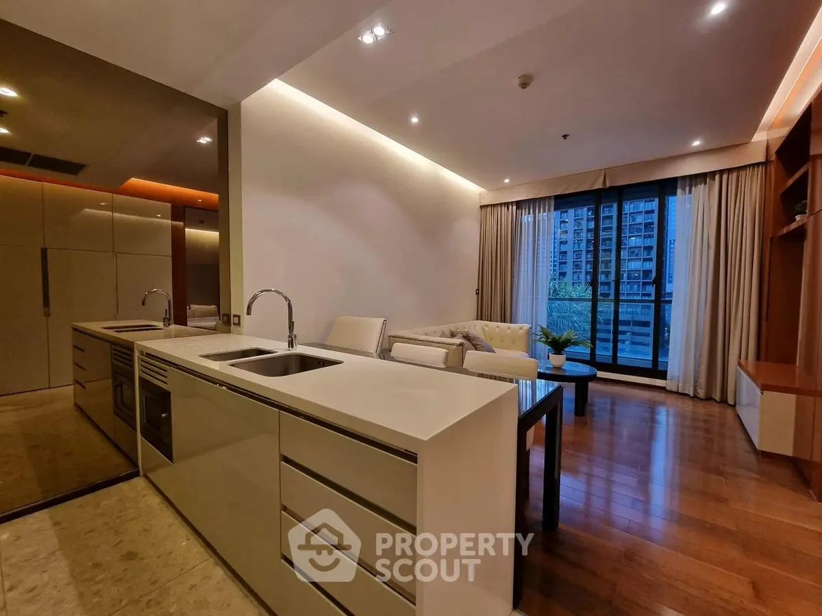 Luxurious modern living room with open kitchen and city view balcony
