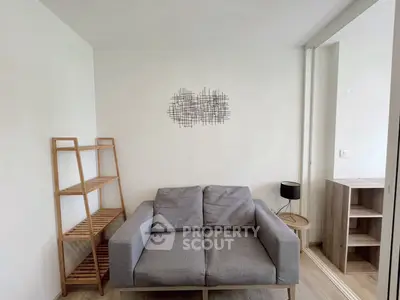 Cozy living room with modern gray sofa and minimalist decor