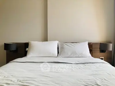 Modern bedroom with cozy double bed and stylish lamps