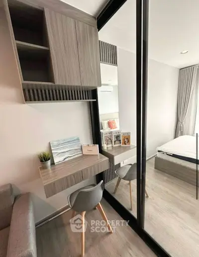 Modern bedroom with stylish study nook and mirrored wardrobe