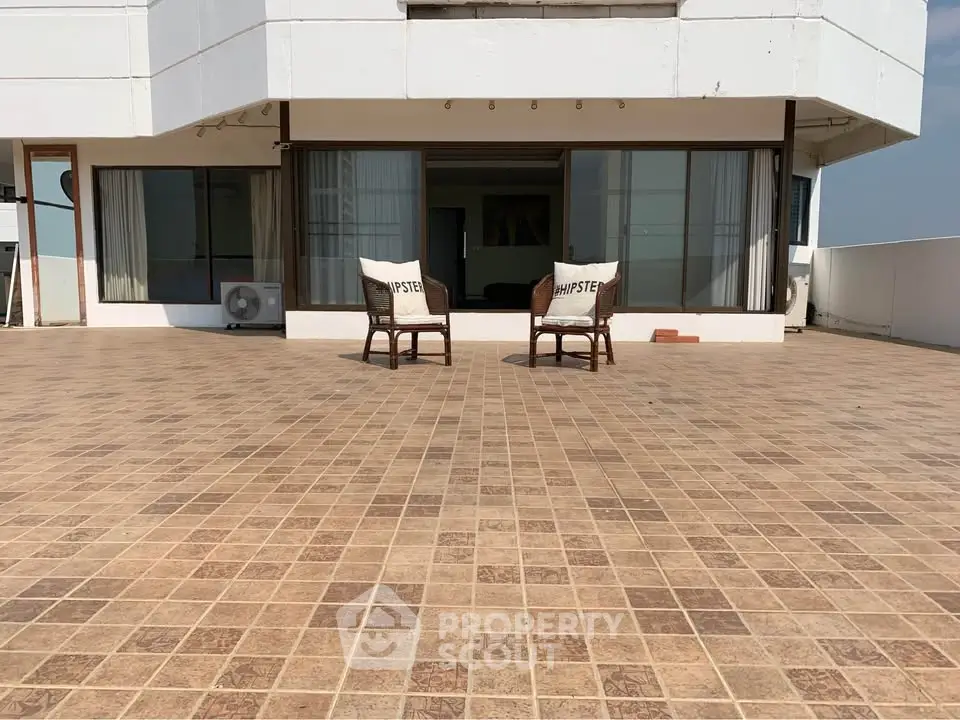 Spacious rooftop terrace with two chairs and panoramic views