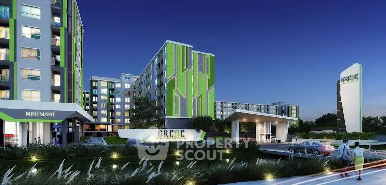 Modern apartment complex with vibrant green accents and night lighting