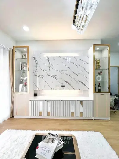 Luxurious living room with elegant marble feature wall and modern decor