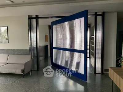 Modern interior with unique pivot door and sleek design