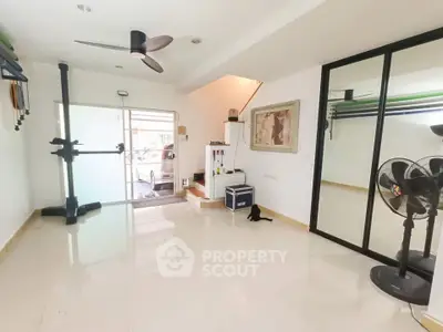 Spacious modern living area with sleek design and ample natural light.